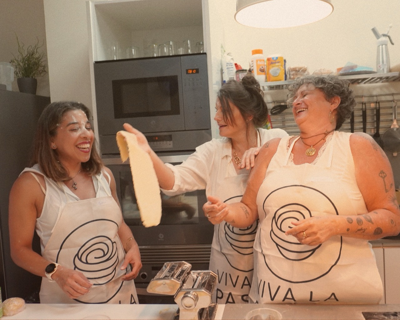 People enjoying a meal together at a long table.